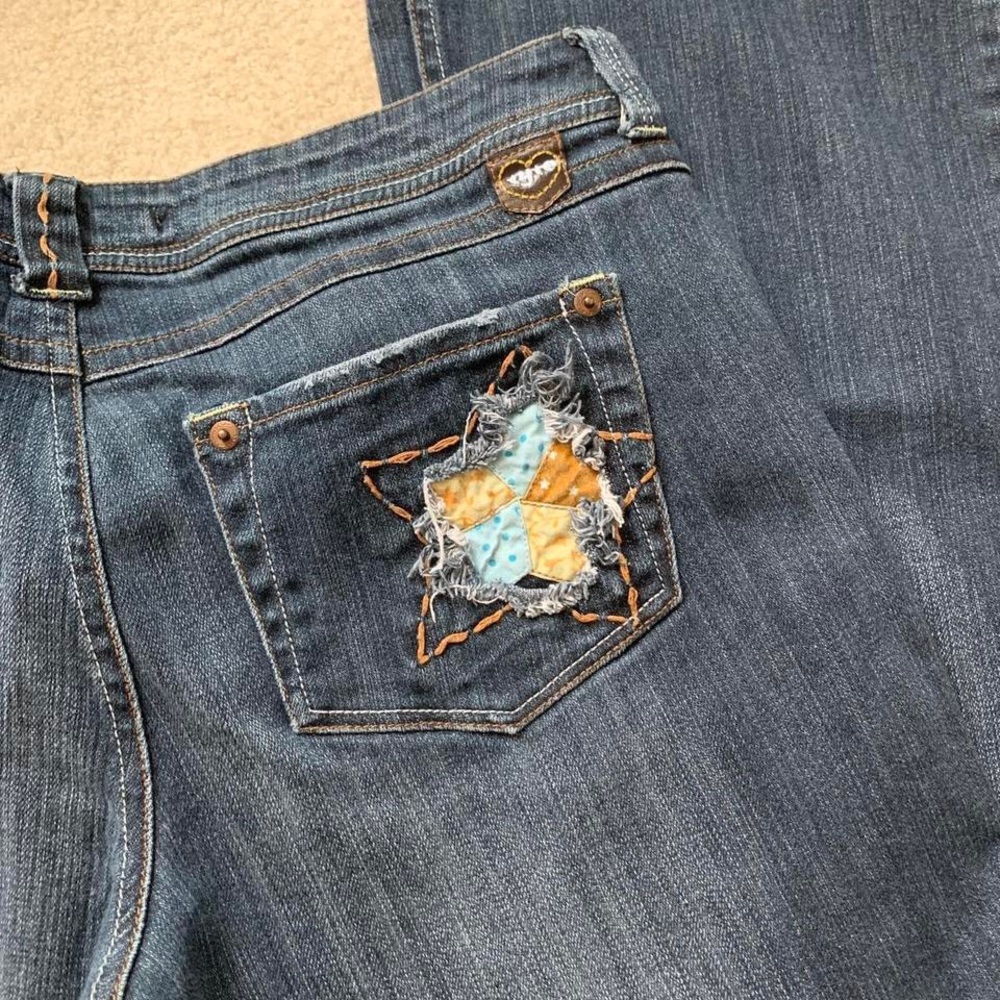 low rise bootcut jeans w/ cute star design on back pocket by tyte